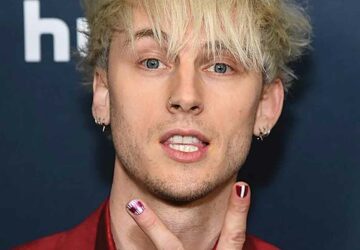 Machine Gun Kelly showcases bold evil eye nailart Machine Gun Kelly showcases bold evil eye nailart